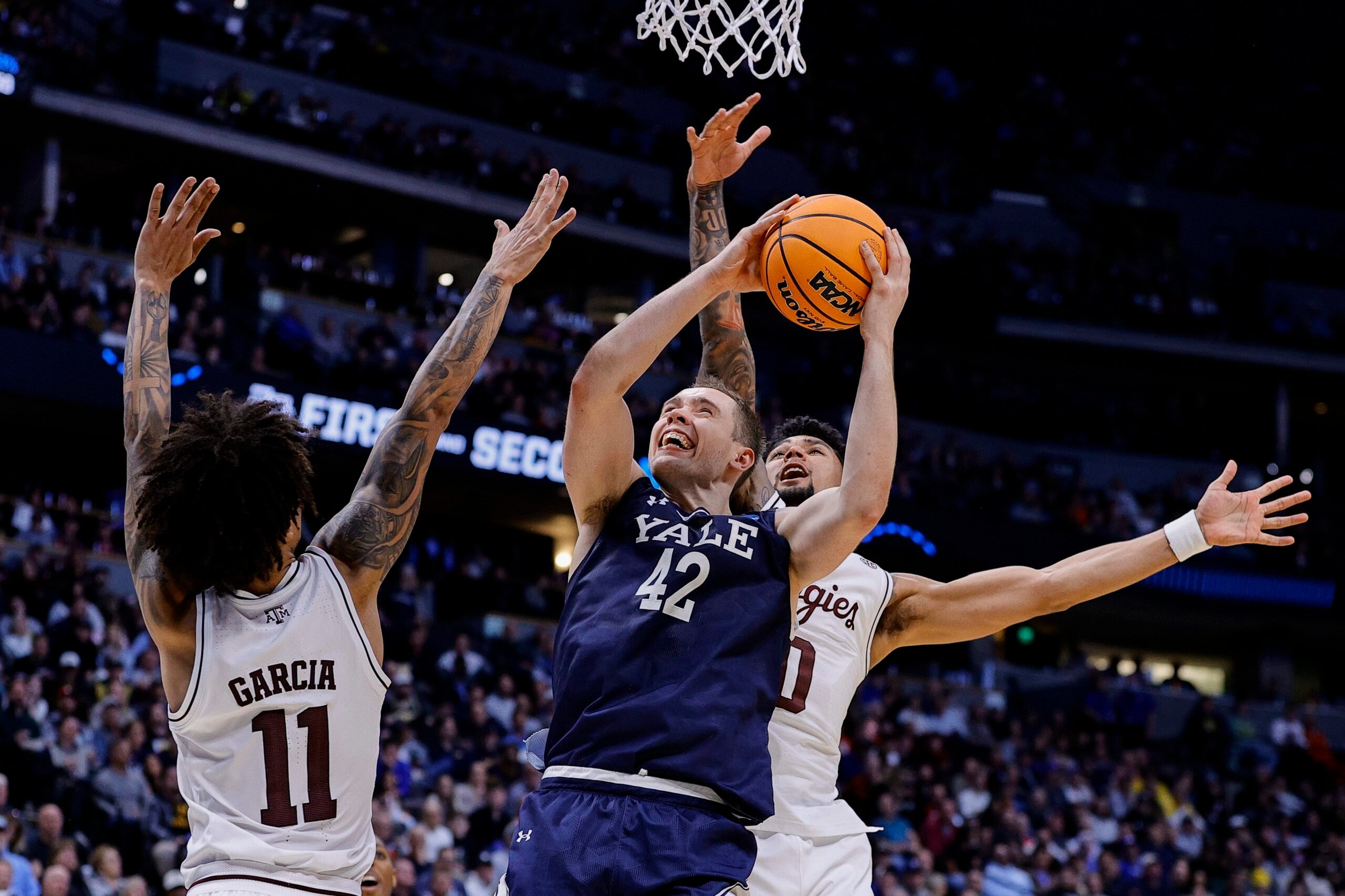 March 20, 2025; Denver, CO, USA; Yale Bulldogs forward Nick Townsend (42) attempts to shoot the ball against the Texas A&M Aggies at Ball Arena. Mandatory Credit: Isaiah J. Downing-Imagn Images