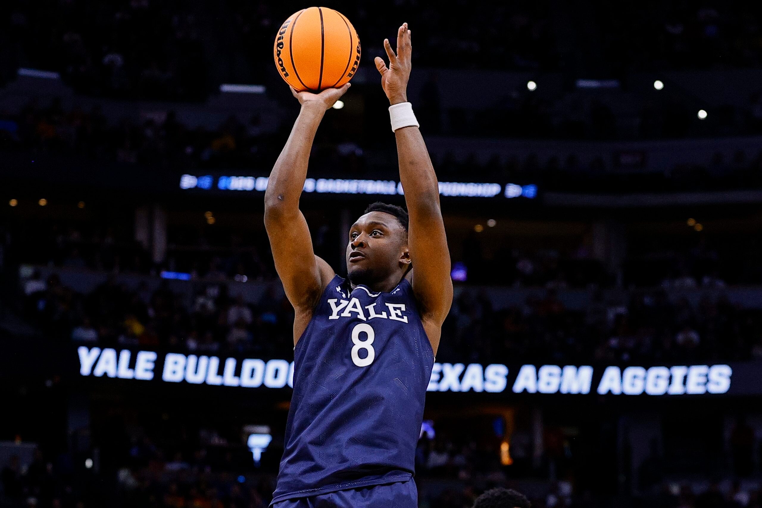 March 20, 2025; Denver, CO, USA; Yale Bulldogs forward Nick Townsend (42) attempts to shoot the ball against the Texas A&M Aggies at Ball Arena. Mandatory Credit: Isaiah J. Downing-Imagn Images
