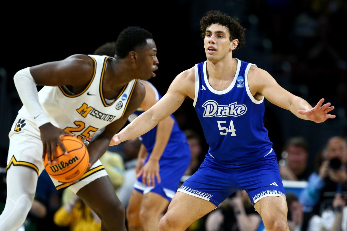 Mar 20, 2025; Wichita, KS, USA; Drake Bulldogs forward Daniel Abreu (54) defends Missouri Tigers guard Mark Mitchell (25) in the second half of a first round men’s NCAA Tournament game at Intrust Bank Arena. Mandatory Credit: Nick Tre. Smith-Imagn Images