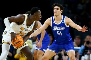 Mar 20, 2025; Wichita, KS, USA; Drake Bulldogs forward Daniel Abreu (54) defends Missouri Tigers guard Mark Mitchell (25) in the second half of a first round men’s NCAA Tournament game at Intrust Bank Arena. Mandatory Credit: Nick Tre. Smith-Imagn Images
