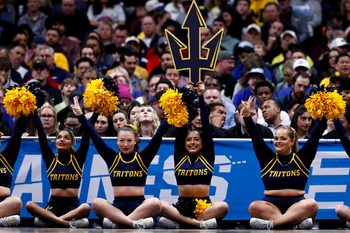 March 20, 2025; Denver, CO, USA; UC San Diego Tritons cheerleaders on the baseline during the first half against the Michigan Wolverines at Ball Arena. Mandatory Credit: Isaiah J. Downing-Imagn Images