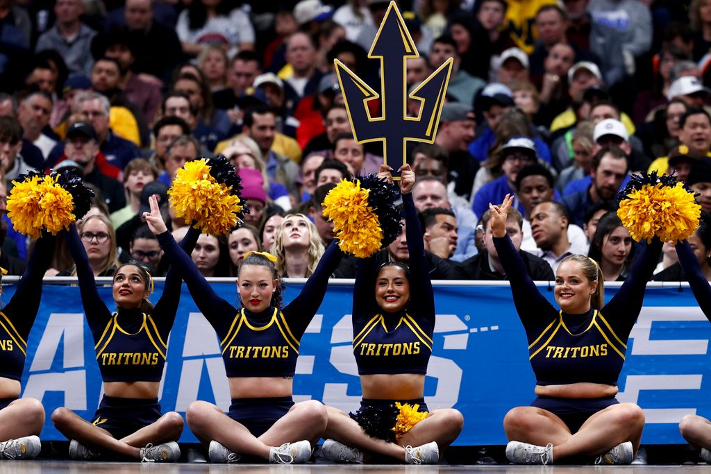 March 20, 2025; Denver, CO, USA; UC San Diego Tritons cheerleaders on the baseline during the first half against the Michigan Wolverines at Ball Arena. Mandatory Credit: Isaiah J. Downing-Imagn Images