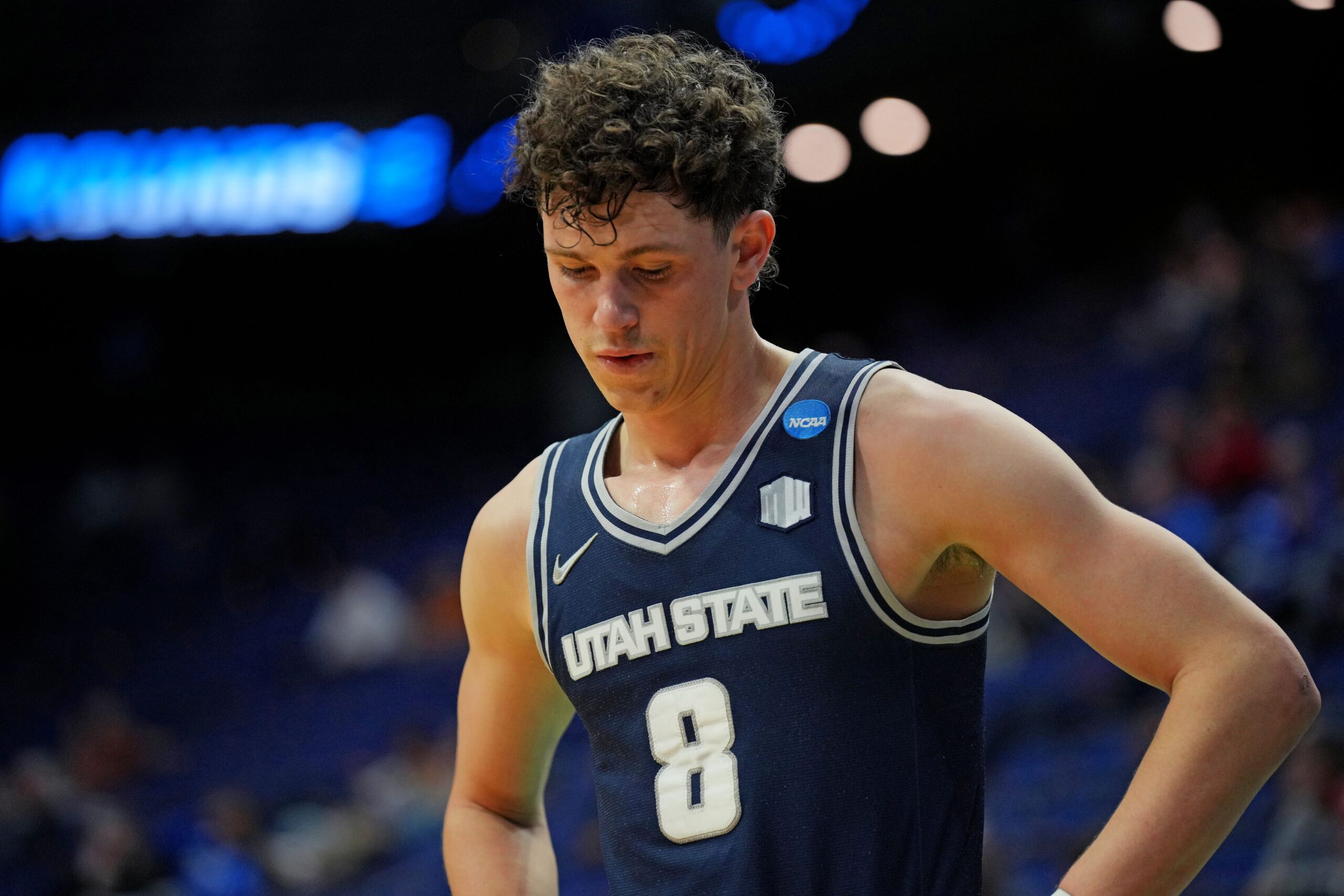 Mar 20, 2025; Lexington, KY, USA;  Utah State Aggies guard Drake Allen (8) reacts during the second half against the UCLA Bruins in the first round of the NCAA Tournament at Rupp Arena. Mandatory Credit: Aaron Doster-Imagn Images