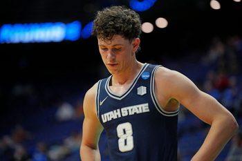 Mar 20, 2025; Lexington, KY, USA;  Utah State Aggies guard Drake Allen (8) reacts during the second half against the UCLA Bruins in the first round of the NCAA Tournament at Rupp Arena. Mandatory Credit: Aaron Doster-Imagn Images
