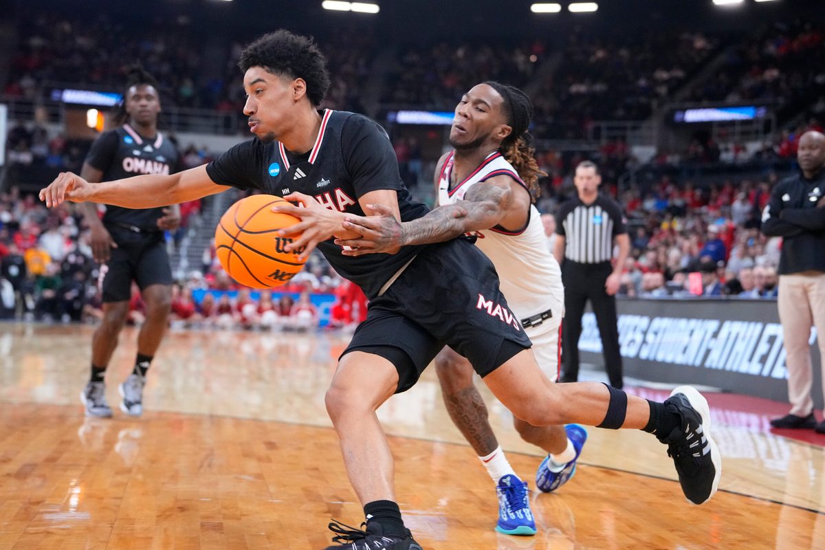Mar 20, 2025; Providence, RI, USA; Omaha Mavericks guard Lance Waddles (7) controls the ball against St. John's Red Storm guard Deivon Smith (5) during the second half at Amica Mutual Pavilion. Mandatory Credit: Gregory Fisher-Imagn Images