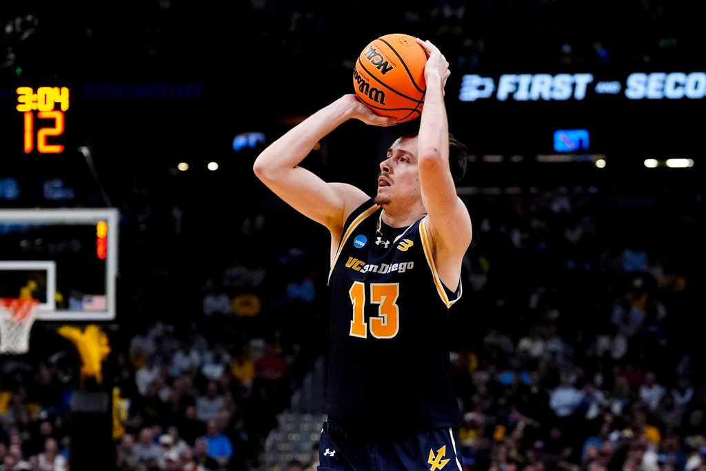 March 20, 2025; Denver, CO, USA; UC San Diego Tritons guard Tyler McGhie (13) shoots a three point basket during the second half against the Michigan Wolverines at Ball Arena. Mandatory Credit: Ron Chenoy-Imagn Images