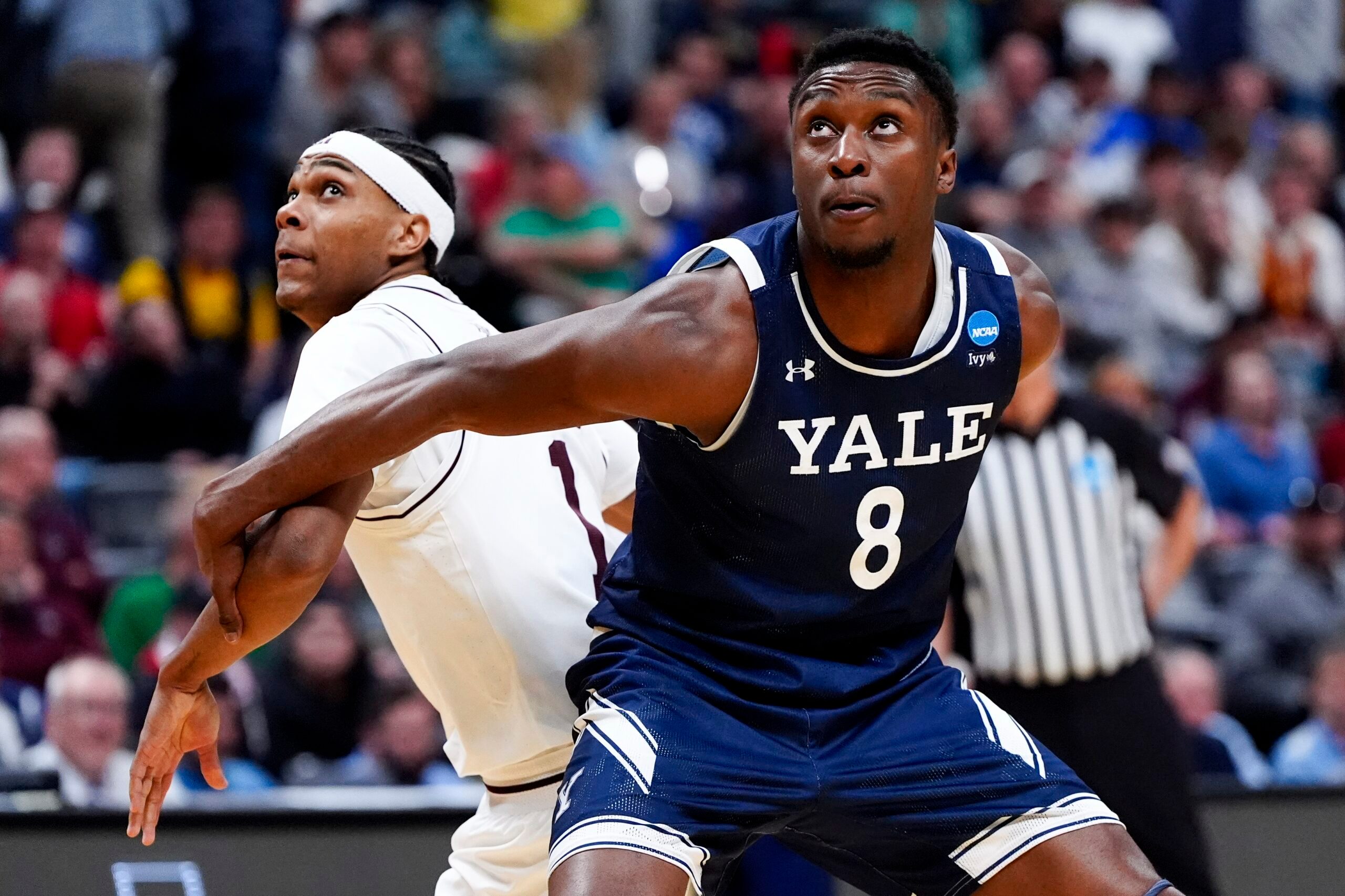March 20, 2025; Denver, CO, USA; Yale Bulldogs forward Isaac Celiscar (8) boxes out Texas A&M Aggies guard Zhuric Phelps (1) during the second half at Ball Arena. Mandatory Credit: Ron Chenoy-Imagn Images