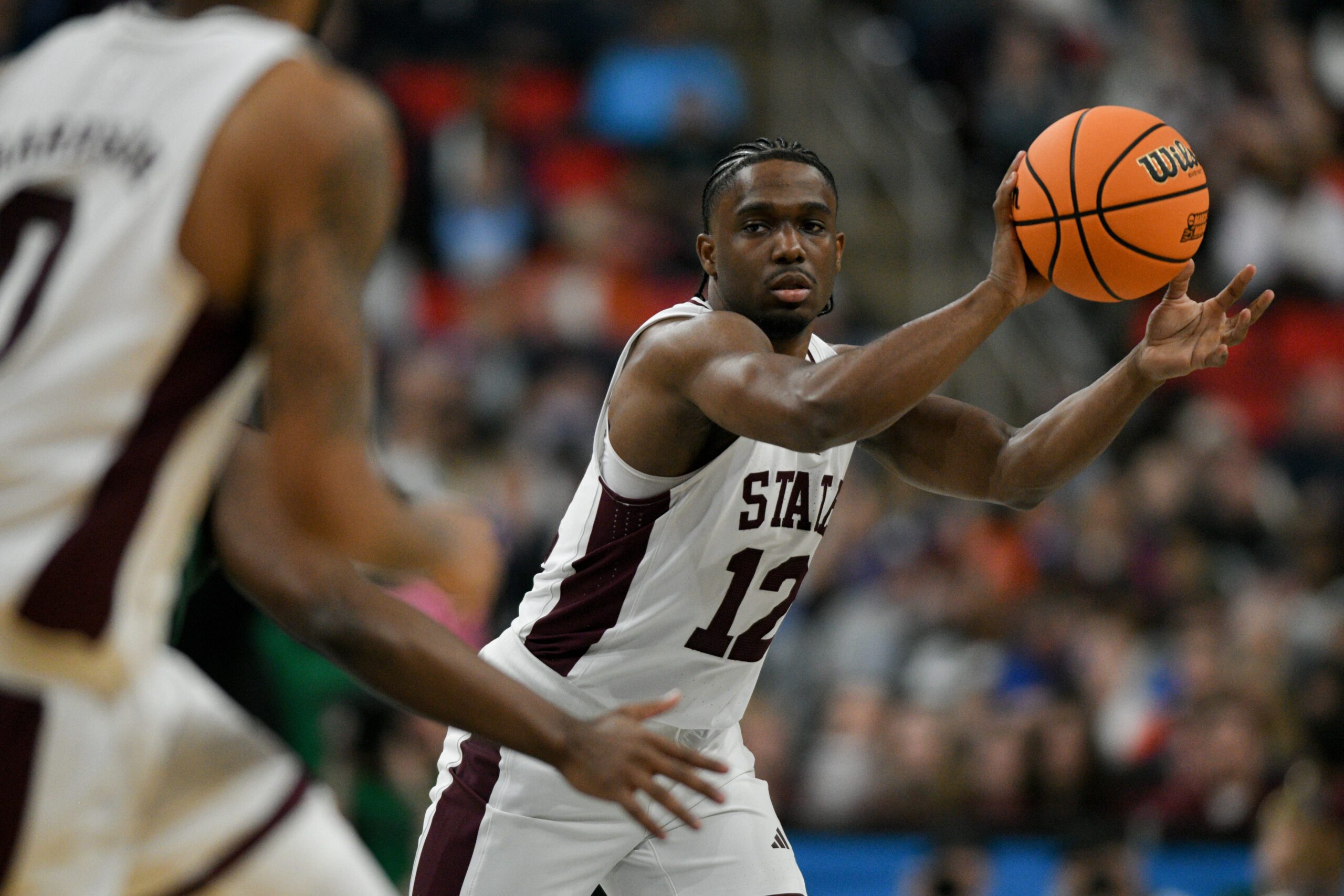 Mar 21, 2025; Raleigh, NC, USA; Mississippi State Bulldogs guard Josh Hubbard (12) passes the ball against the Baylor Bears during the first half in the first round of the NCAA Tournament at Lenovo Center. Mandatory Credit: Zachary Taft-Imagn Images