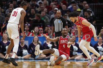 Robert Morris Colonials guard Josh Omojafo (4) reacts after fouling Alabama Crimson Tide forward Derrion Reid (35) during the first half of an NCAA Tournament First Round game at Rocket Arena on Friday, March 21, 2025, in Cleveland, Ohio.