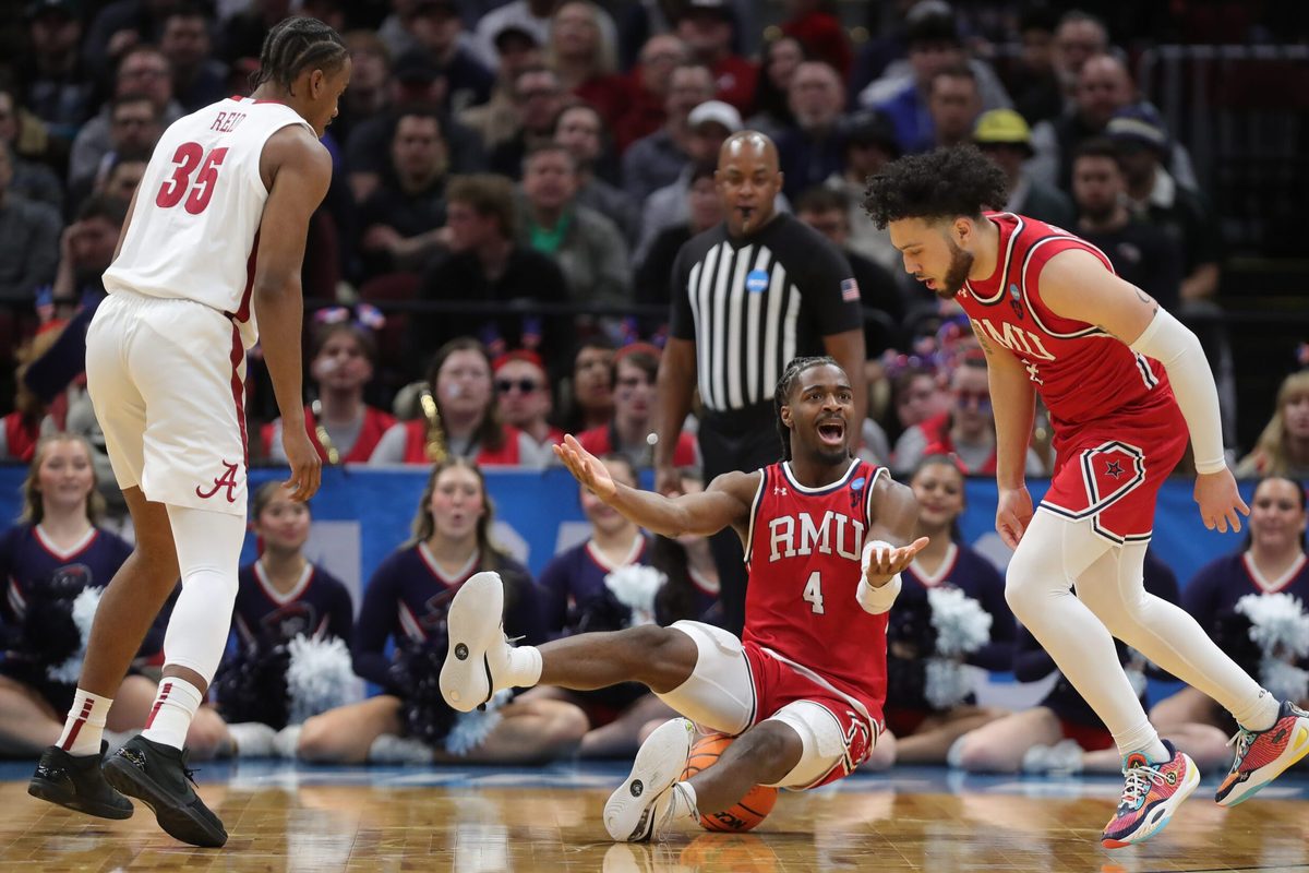 Robert Morris Colonials guard Josh Omojafo (4) reacts after fouling Alabama Crimson Tide forward Derrion Reid (35) during the first half of an NCAA Tournament First Round game at Rocket Arena on Friday, March 21, 2025, in Cleveland, Ohio.