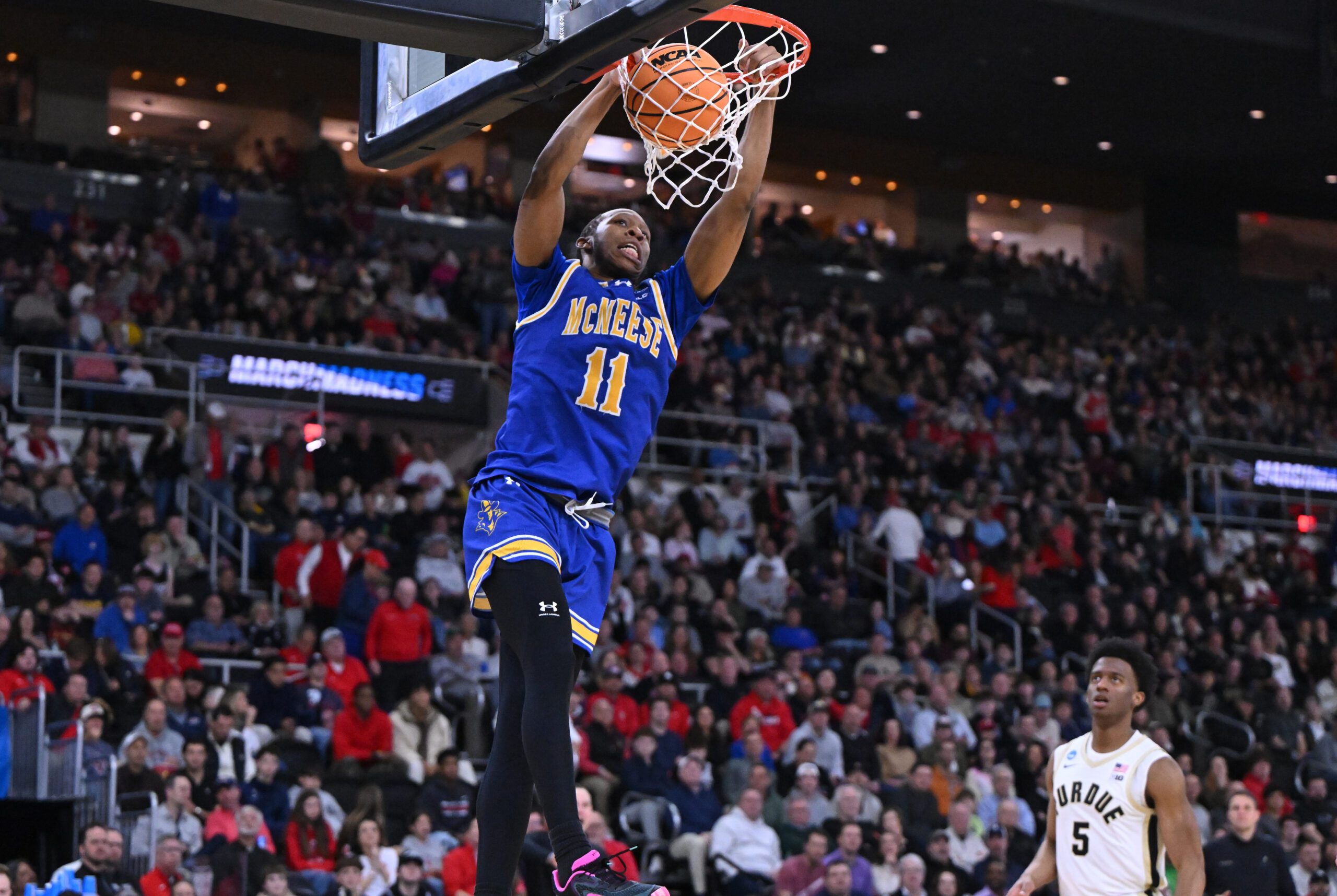 Mar 22, 2025; Providence, RI, USA; McNeese State Cowboys guard Quadir Copeland (11) dunks during the second half of a second round men’s NCAA Tournament game against the Purdue Boilermakers at Amica Mutual Pavilion. Mandatory Credit: Brian Fluharty-Imagn Images