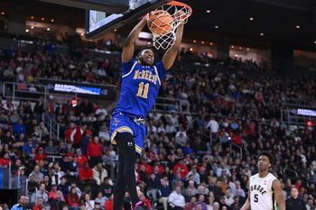 Mar 22, 2025; Providence, RI, USA; McNeese State Cowboys guard Quadir Copeland (11) dunks during the second half of a second round men’s NCAA Tournament game against the Purdue Boilermakers at Amica Mutual Pavilion. Mandatory Credit: Brian Fluharty-Imagn Images
