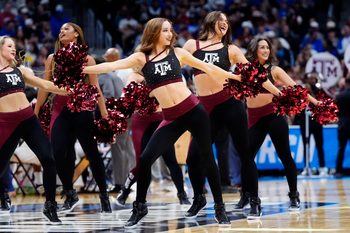 Mar 22, 2025; Denver, CO, USA; Texas A&M Aggies cheerleaders perform during the first half in the second round of the NCAA Tournament  at Ball Arena. Mandatory Credit: Ron Chenoy-Imagn Images