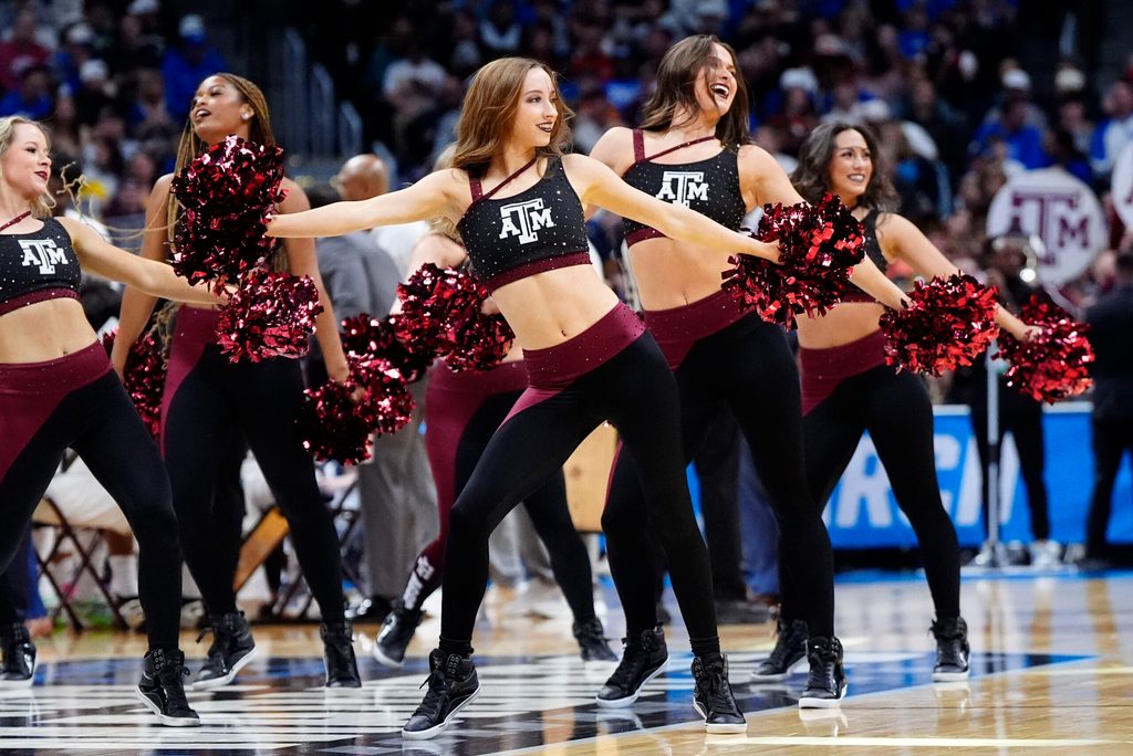 Mar 22, 2025; Denver, CO, USA; Texas A&M Aggies cheerleaders perform during the first half in the second round of the NCAA Tournament at Ball Arena. Mandatory Credit: Ron Chenoy-Imagn Images