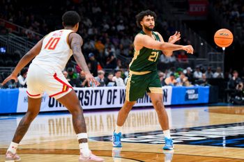 Mar 23, 2025; Seattle, WA, USA; Colorado State Rams forward Rashaan Mbemba (21) passes the ball against the Maryland Terrapins in the first half at Climate Pledge Arena. Mandatory Credit: Steven Bisig-Imagn Images