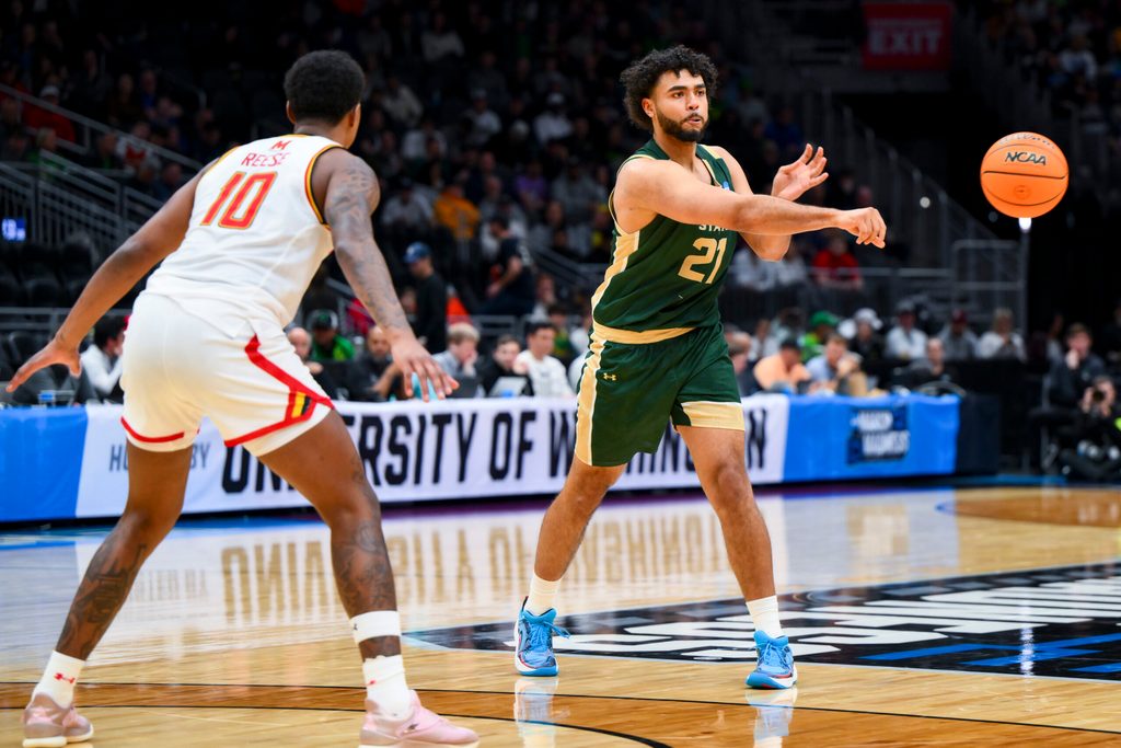 Mar 23, 2025; Seattle, WA, USA; Colorado State Rams forward Rashaan Mbemba (21) passes the ball against the Maryland Terrapins in the first half at Climate Pledge Arena. Mandatory Credit: Steven Bisig-Imagn Images