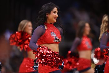 Mar 28, 2025; Atlanta, GA, USA; Mississippi Rebels cheerleaders in the first half of a South Regional semifinal of the 2025 NCAA tournament against the Michigan State Spartans at State Farm Arena. Mandatory Credit: Brett Davis-Imagn Images