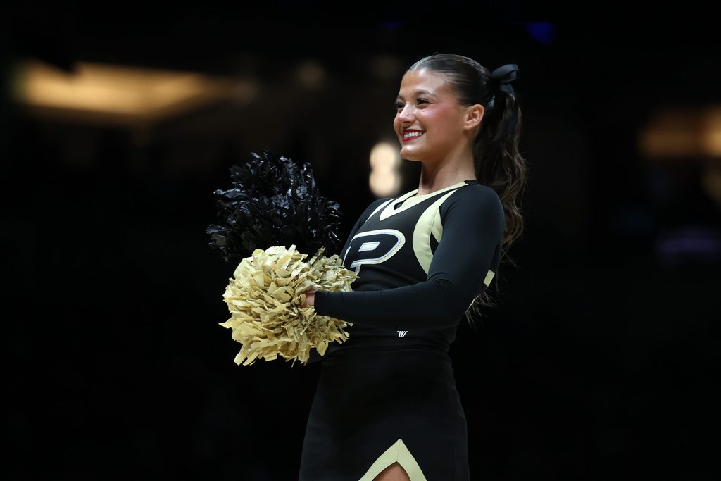 Mar 28, 2025; Indianapolis, IN, USA; The Purdue Boilermakers cheerleaders perform in the first half during a Midwest Regional semifinal of the 2025 NCAA tournament at Lucas Oil Stadium. Mandatory Credit: Trevor Ruszkowski-Imagn Images