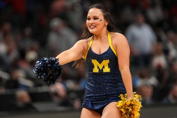 Mar 28, 2025; Atlanta, GA, USA; Michigan Wolverines cheerleaders in the second half of a South Regional semifinal of the 2025 NCAA tournament against the Auburn Tigers at State Farm Arena. Mandatory Credit: Brett Davis-Imagn Images