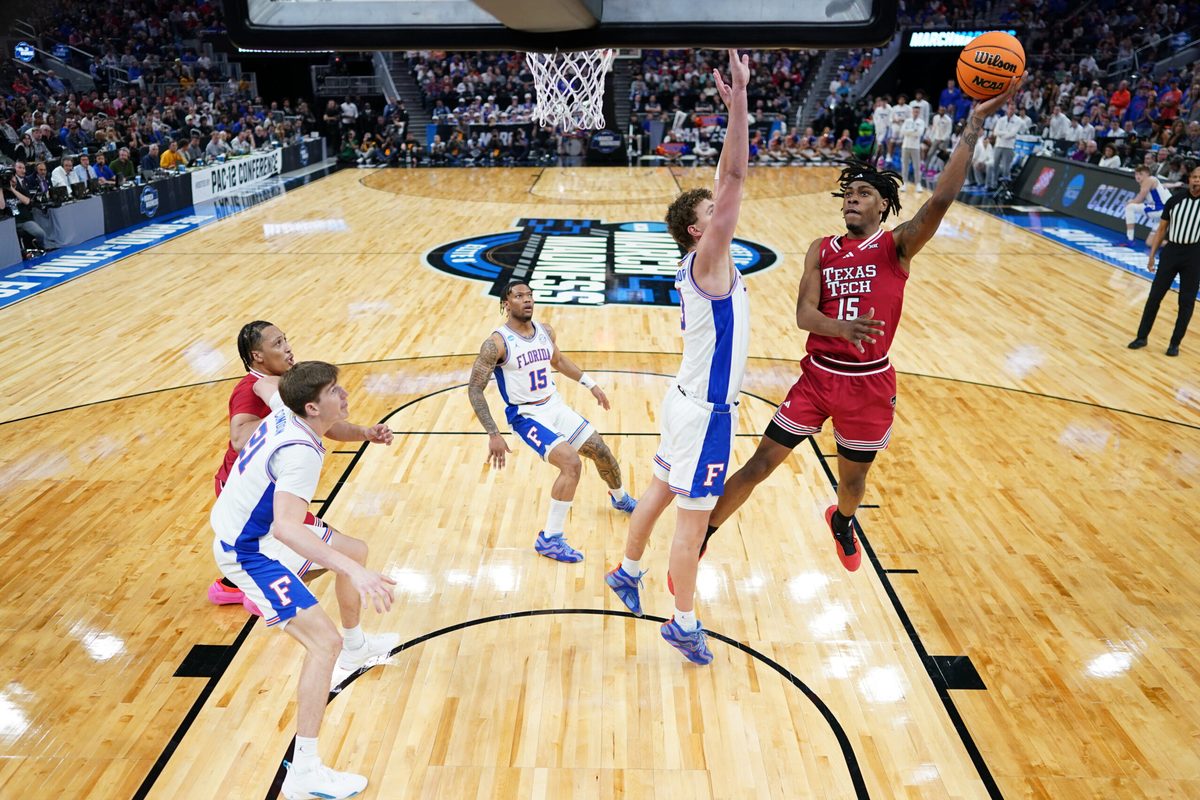 Mar 29, 2025; San Francisco, CA, USA; Texas Tech Red Raiders forward JT Toppin (15) drives to the hoop past Florida Gators center Micah Handlogten (3) during the second half during the West Regional final of the 2025 NCAA tournament at Chase Center. Mandatory Credit: Kyle Terada-Imagn Images