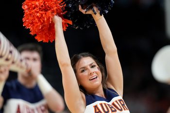 Mar 30, 2025; Atlanta, GA, USA; Auburn Tigers cheerleaders during the first half in the South Regional final of the 2025 NCAA tournament against the Michigan State Spartans at State Farm Arena. Mandatory Credit: Dale Zanine-Imagn Images