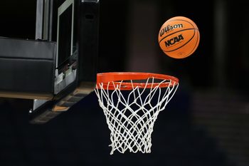 Apr 3, 2025; Tampa, FL, USA; A Wilson EVO Nxt basketball ball with the 2025 NCAA Women's Final Four logo approaches the rim and the net at Amalie Arena. Mandatory Credit: Kirby Lee-Imagn Images