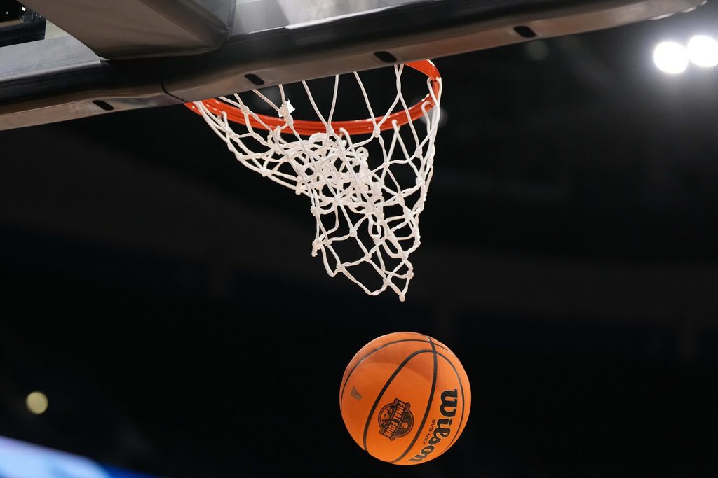 Apr 3, 2025; Tampa, FL, USA; A Wilson EVO Nxt basketball ball with the 2025 NCAA Women's Final Four logo approaches the rim and the net at Amalie Arena. Mandatory Credit: Kirby Lee-Imagn Images