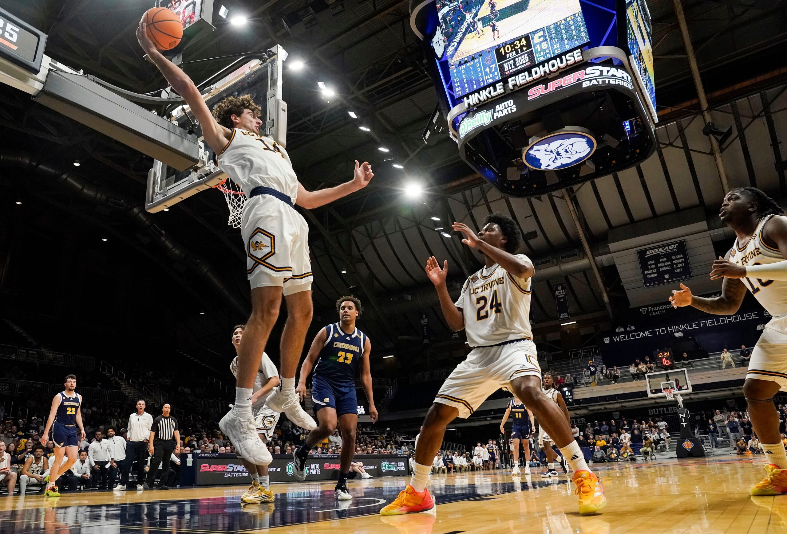 UC Irvine Anteaters forward Kyle Evans (14) throws the ball back in bounds to UC Irvine Anteaters guard Jurian Dixon (24) on Thursday, April 3, 2025, during the National Invitational Tournament at Hinkle Fieldhouse in Indianapolis.