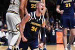 Chattanooga Mocs forward Garrison Keeslar (24) yells in excitement Thursday, April 3, 2025, during the National Invitational Tournament at Hinkle Fieldhouse in Indianapolis.