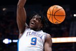 Florida center Rueben Chinyelu (9) dunks against Florida during the championship game of the SEC Men's Basketball Tournament at Bridgestone Arena in Nashville, Tenn., Sunday, March 16, 2025.