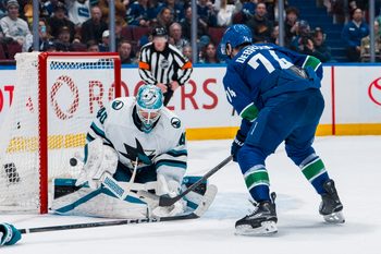 Apr 14, 2025; Vancouver, British Columbia, CAN; Vancouver Canucks forward Jake DeBrusk (74) scores on San Jose Sharks goalie Alexandar Georgiev (40) in overtime at Rogers Arena. Mandatory Credit: Bob Frid-Imagn Images