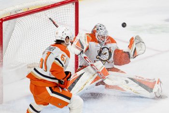Apr 15, 2025; Saint Paul, Minnesota, USA; A shot by Minnesota Wild left wing Matt Boldy (12) goes over the shoulder of Anaheim Ducks goaltender Lukas Dostal (1) clinching a playoff birth for the Minnesota Wild in overtime at Xcel Energy Center. Mandatory Credit: Matt Blewett-Imagn Images