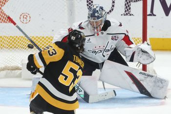 Apr 17, 2025; Pittsburgh, Pennsylvania, USA;  Pittsburgh Penguins center Philip Tomasino (53) scores a goal past Washington Capitals goaltender Clay Stevenson (33) during the third period at PPG Paints Arena. Mandatory Credit: Charles LeClaire-Imagn Images