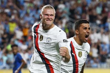 [Subscription Customers Only] Jun 30, 2025; Orlando, Florida, USA; Manchester City forward Erling Haaland (9) celebrates scoring their second goal with midfielder Rodri (16) during a round of 16 match of the 2025 FIFA Club World Cup at Camping World Stadium. Mandatory Credit: Lee Smith-Reuters via Imagn Images