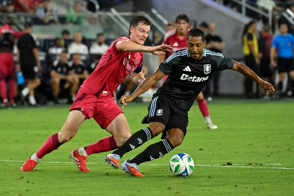 Jul 30, 2025; St. Louis, Missouri, USA; St. Louis City midfielder Chris Durkin (8) battles Aston Villa midfielder Youri Tielemans (8) for the ball in the second half at Energizer Park. Mandatory Credit: Joe Puetz-Imagn Images