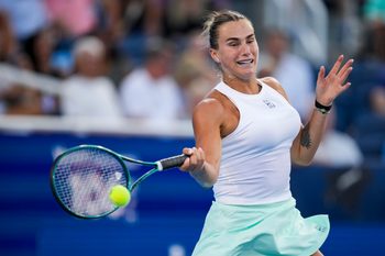Aug 9, 2025; Cincinnati, OH, USA; Aryna Sabalenka (BLR) returns a shot against Marketa Vondrousova (CZE) during the Cincinnati Open at the Lindner Family Tennis Center. Mandatory Credit: Aaron Doster-Imagn Images