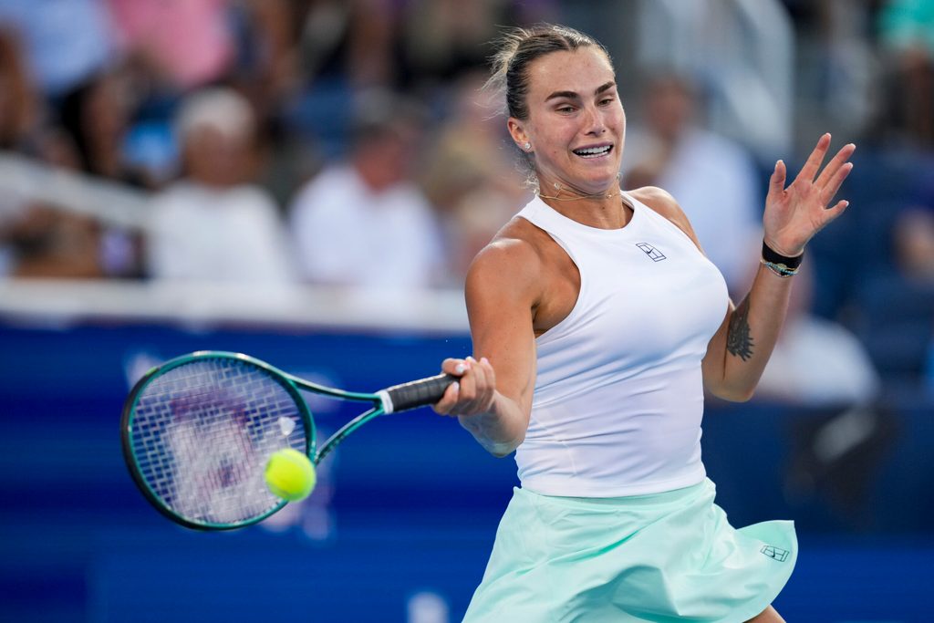 Aug 9, 2025; Cincinnati, OH, USA; Aryna Sabalenka (BLR) returns a shot against Marketa Vondrousova (CZE) during the Cincinnati Open at the Lindner Family Tennis Center. Mandatory Credit: Aaron Doster-Imagn Images