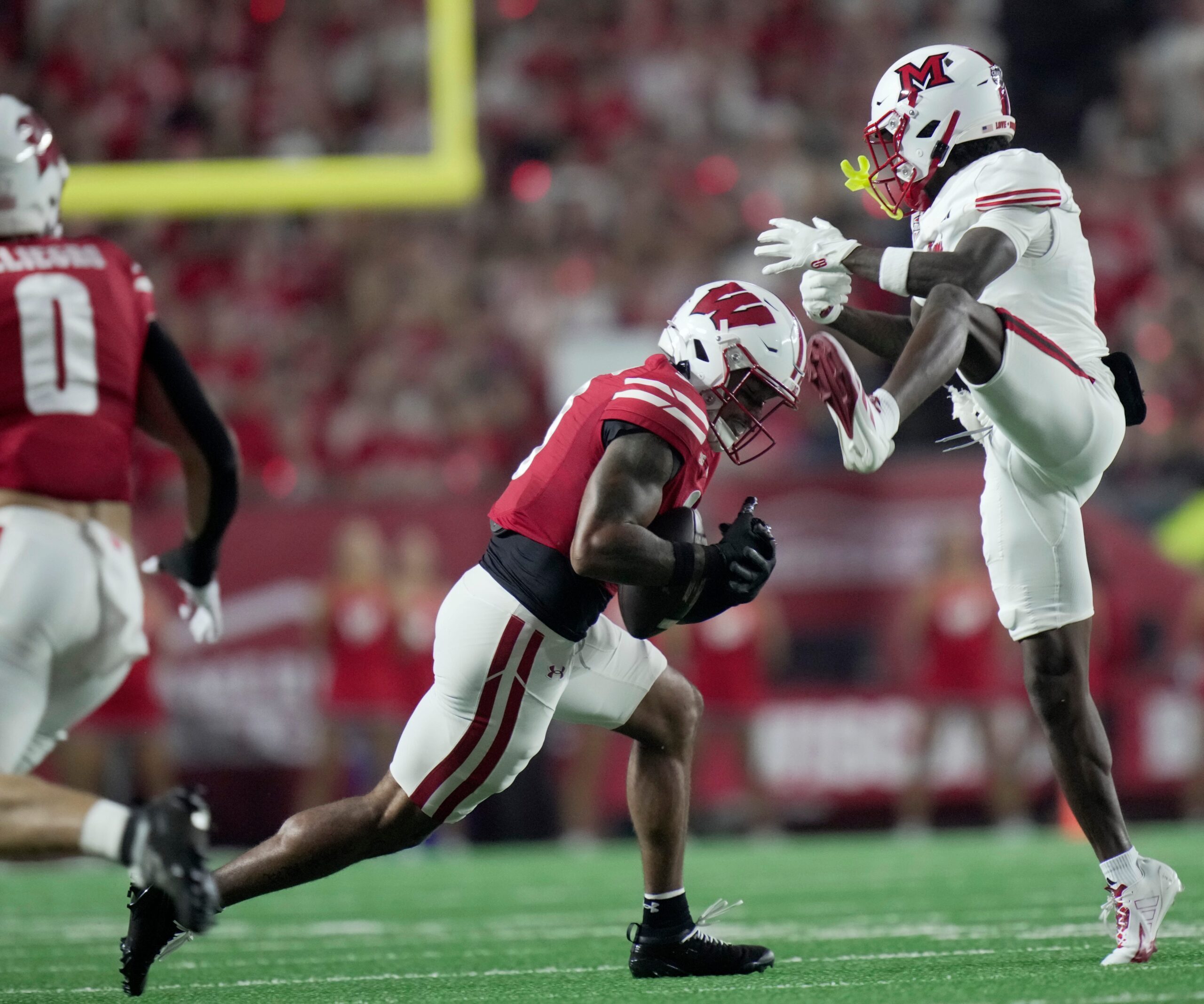 Wisconsin safety Austin Brown (9) breaks up a pass intended Miami (Ohio) wide receiver Kam Perry (8) during the first quarter August 28 Camp Randall Stadium.