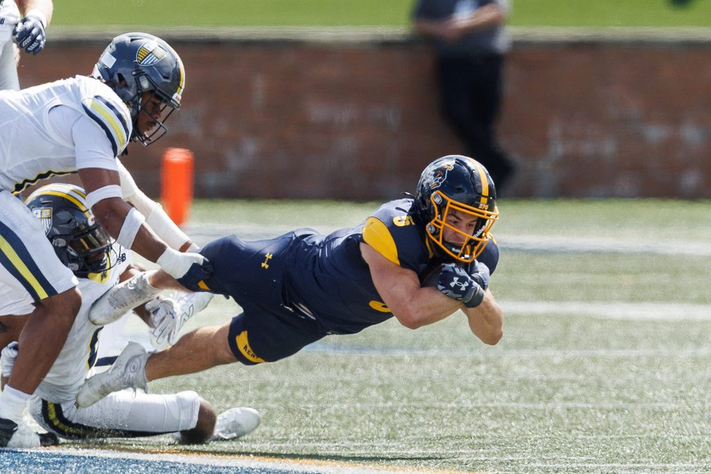 Kent State running back Gavin Garcia dives for an extra yard during the season opener against Merrimack College Saturday, August 30, 2025 in Kent, OH.