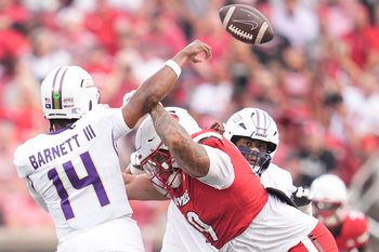 Louisville Cardinals defensive lineman Jordan Guerad (99) pressures James Madison Dukes quarterback Alonza Barnett III (14) in the first half Friday September 5, 2025 at L&N Federal Credit Union Stadium in Louisville, Kentucky.
