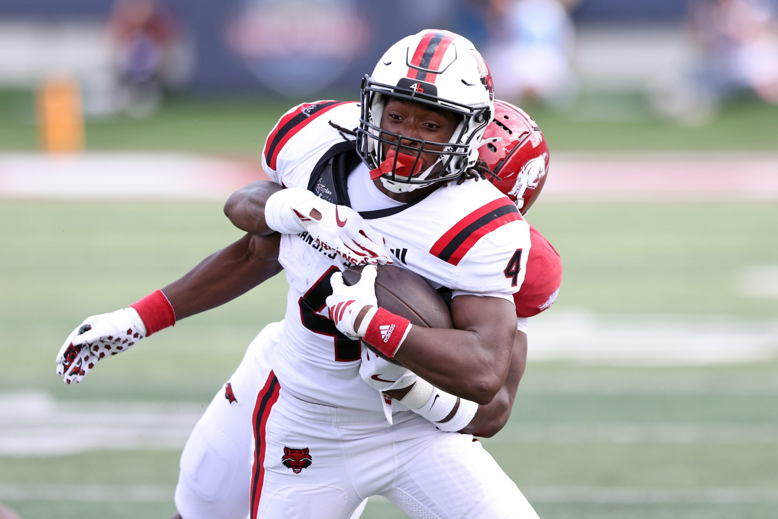 Sep 6, 2025; Little Rock, Arkansas, USA; Arkansas State Red Wolves running back Devin Spencer (40) rushes during the second quarter against the Arkansas Razorbacks at War Memorial Stadium. Mandatory Credit: Nelson Chenault-Imagn Images