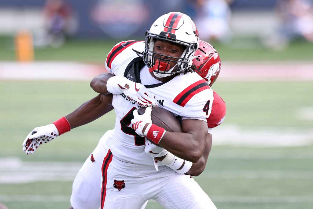 Sep 6, 2025; Little Rock, Arkansas, USA; Arkansas State Red Wolves running back Devin Spencer (40) rushes during the second quarter against the Arkansas Razorbacks at War Memorial Stadium. Mandatory Credit: Nelson Chenault-Imagn Images