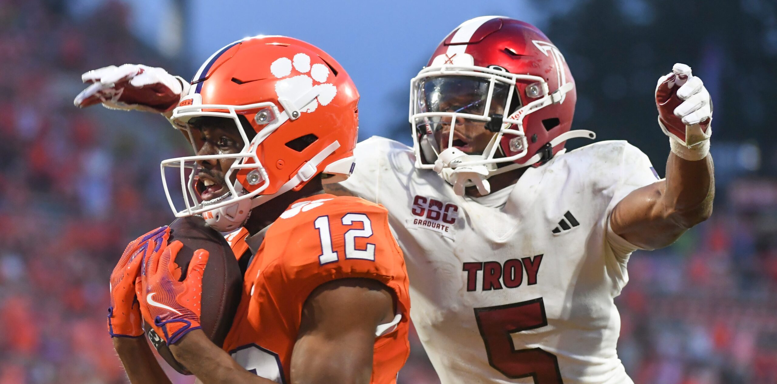 Clemson Tigers wide receiver Bryant Wesco Jr. (12) catches a pass for a touchdown while being defended by Troy Trojans cornerback Kaleno Levine (5) Saturday, Sept. 6, 2025 during the NCAA football game at Memorial Stadium in Clemson, South Carolina.