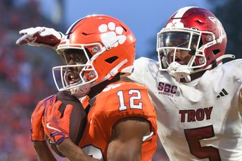 Clemson Tigers wide receiver Bryant Wesco Jr. (12) catches a pass for a touchdown while being defended by Troy Trojans cornerback Kaleno Levine (5) Saturday, Sept. 6, 2025 during the NCAA football game at Memorial Stadium in Clemson, South Carolina.