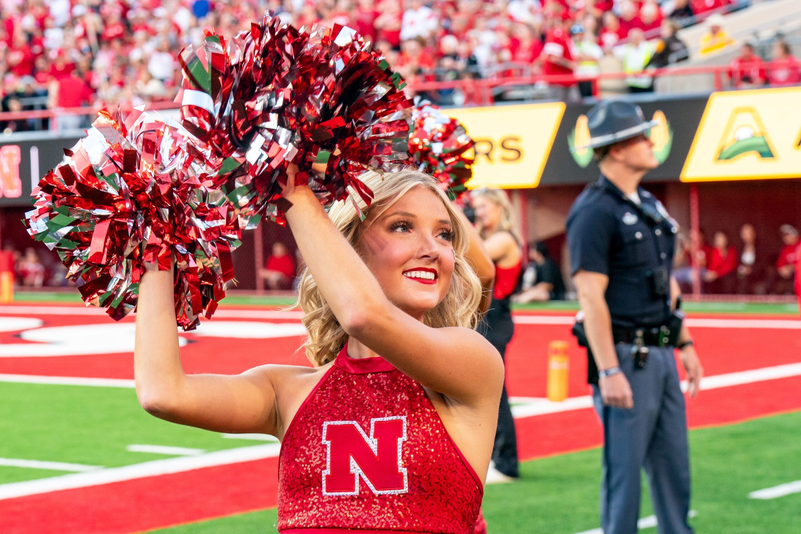 Sep 6, 2025; Lincoln, Nebraska, USA; A Nebraska Cornhuskers cheerleader cheers during the first quarter against the Akron Zips at Memorial Stadium. Mandatory Credit: Dylan Widger-Imagn Images