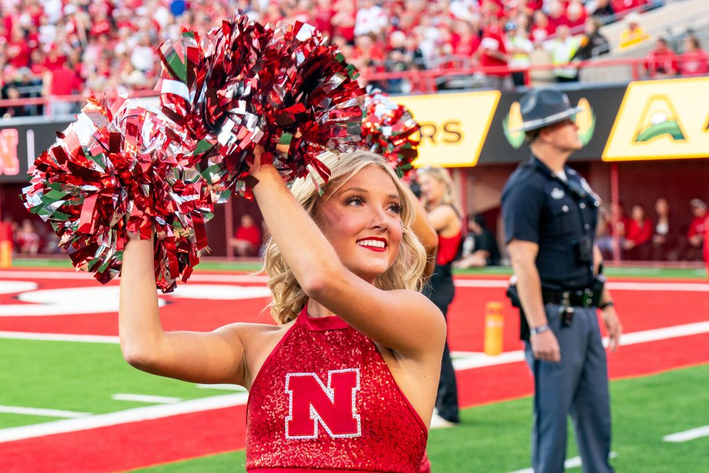 Sep 6, 2025; Lincoln, Nebraska, USA; A Nebraska Cornhuskers cheerleader cheers during the first quarter against the Akron Zips at Memorial Stadium. Mandatory Credit: Dylan Widger-Imagn Images