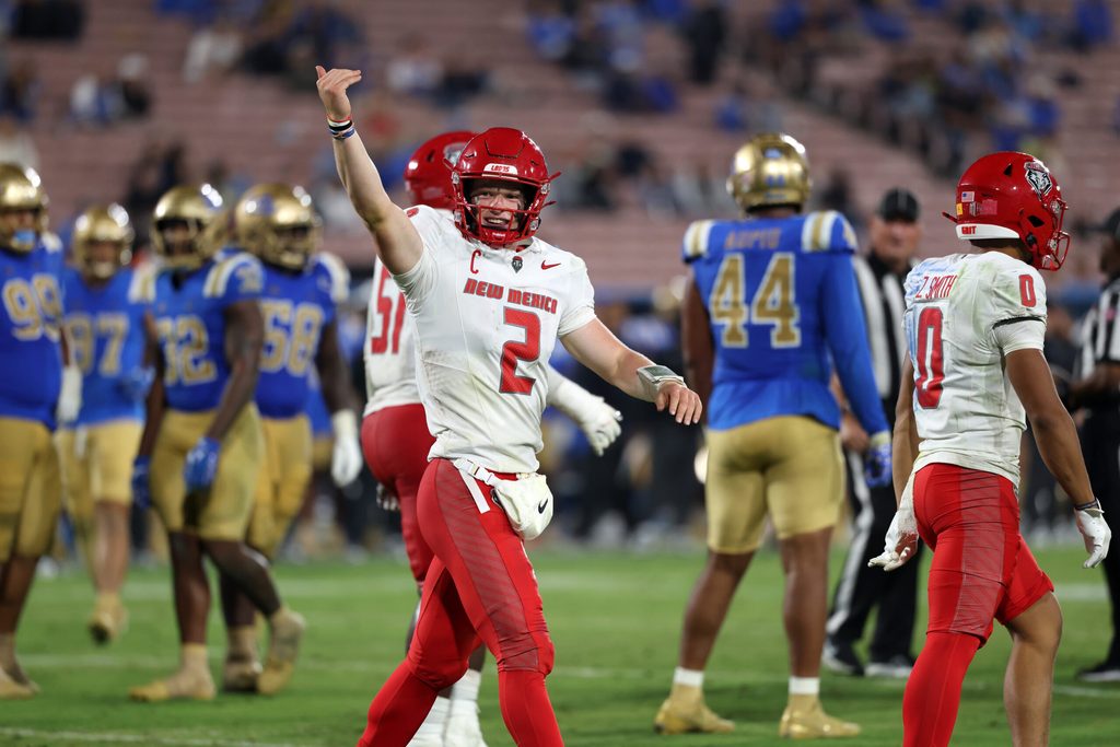 Sep 12, 2025; Pasadena, California, USA; New Mexico Lobos quarterback Jack Layne (2) reacts after his team scored a touchdown during the fourth quarter against the UCLA Bruins at Rose Bowl. Mandatory Credit: Kiyoshi Mio-Imagn Images