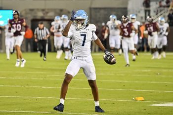 Sep 13, 2025; Blacksburg, Virginia, USA;  Old Dominion Monarchs wide receiver Na'eem Abdul-Rahim Gladding (7) celebrates a first down during the second quarter at Lane Stadium. Mandatory Credit: Brian Bishop-Imagn Images
