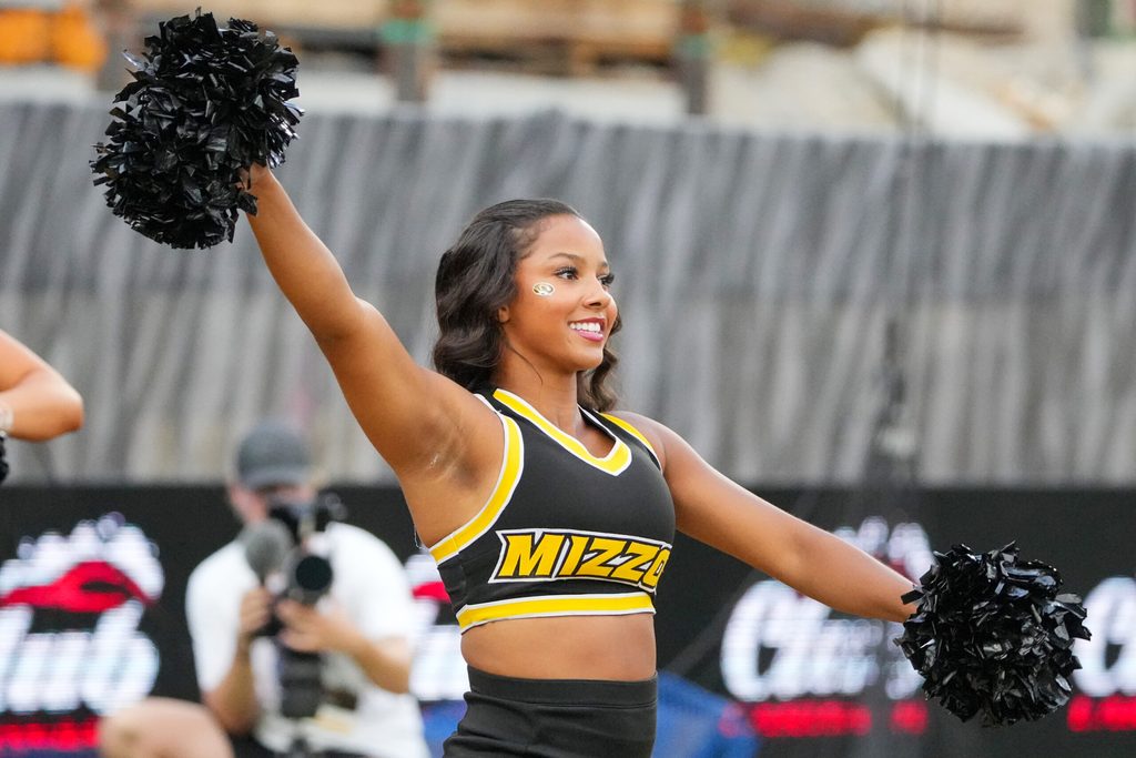 Sep 20, 2025; Columbia, Missouri, USA; A Missouri Tigers cheerleader performs against the South Carolina Gamecocks prior to a game at Faurot Field at Memorial Stadium. Mandatory Credit: Denny Medley-Imagn Images