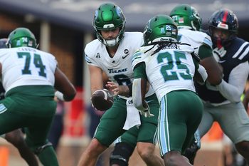 Sep 20, 2025; Oxford, Mississippi, USA; Tulane Green Wave quarterback Brendan Sullivan (6) hands the ball off to running back Jamauri McClure (25) during the fourth quarter against the Mississippi Rebels at Vaught-Hemingway Stadium. Mandatory Credit: Petre Thomas-Imagn Images